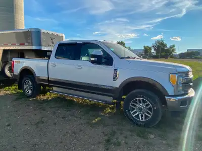 This 2017 Ford F350 features the powerful Power Stroke engine and comes in a white and brown exterio...