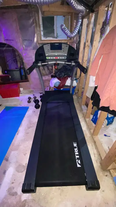 Selling TRUE Fitness PS100 treadmill due to moving. Will include treadmill lube. Works like brand ne...