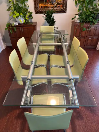 Structube Europa extendable glass dining table and 6 chairs. Table is 76cm tall; 80cm wide. It is 14...
