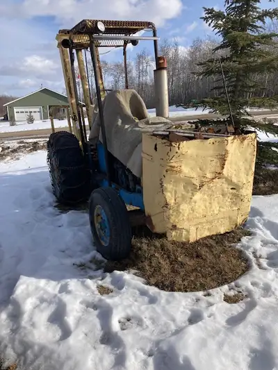 gord 3500 tractor with fork lift attachment 6000 lbs lifting capacity 3cyl gas motor power streering...