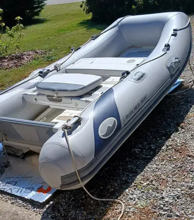 LIKE NEW! $7,200 (or best offer), Stored indoors. Includes Honda Marine 9.9 Outboard tiller handle c...