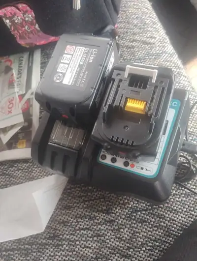 2  brand new Makita batteries and charger, View more