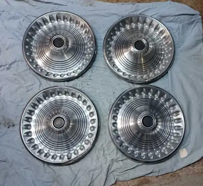 Set of 4 Plymouth 14" hubcaps wheel covers from early 1970's. They show normal wear, one has more da...