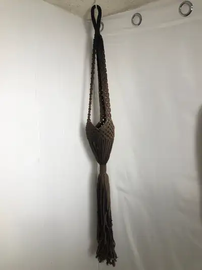 Brown Macrame Plant Hanger. 49” Long. Like New. Holds up to a 7” pot. $40 Cash or etransfer Coliseum...