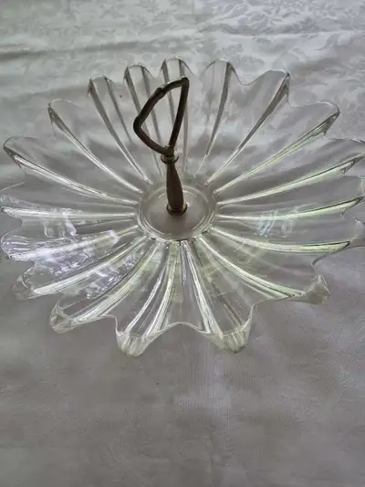 Add a touch of vintage elegance to your table setting with this beautiful, used glass serving plate...