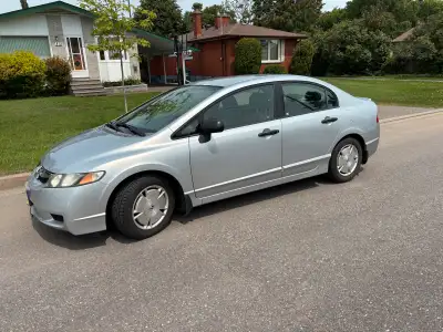Honda Civic DX - G . Four door sedan. 82 , 513 kilometres (51, 250 miles). Silver. 5 speed manual tr...
