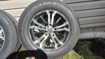 15 inch universal fit mag wheels with 20570R15 Yokohama tires installed. Tires are used, May have an...