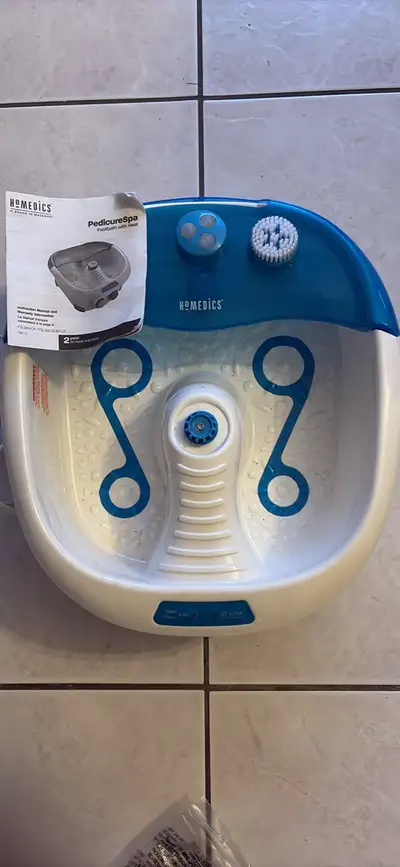 Treat your tired feet to a relaxing home experience with this HoMedics Pedicure Spa, which is in goo...