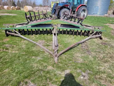John deere disc, 16 feet wide folded up or 20 foot wide with the wings down, hitch slides back and f...