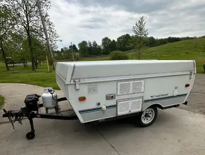 We moved up to a bigger travel trailer so our well-loved pop-up is looking for a new home. It has an...
