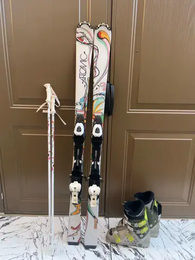 143 Atomic ski with boots poles , View more