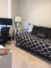Clean bedroom in a new apartment building in North Glenmore.