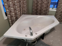 Acrylic corner soaker tub