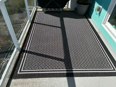 Two outdoor carpets for balconys/decks/etc - 7feet by 10feet - colors beige/white/black Pics taken o...
