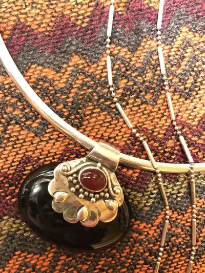 Onyx and silver pendant on silver collar $120. Carnelian and garnet necklace $65. Variety of silver...