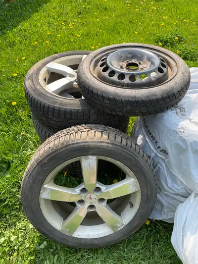 Selling 4 used studded Firestone winter tires on rims for a Pontiac G6 along with a spare donut. Abo...