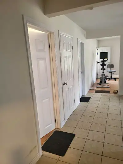 Bright and functional living space available for rent featuring neutral paint and practical flooring...