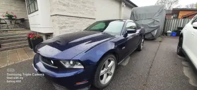 2011 Mustang GT; 105,000km, 5.0L V8; 6 speed manual transmission; All stock except GT500 mufflers; S...