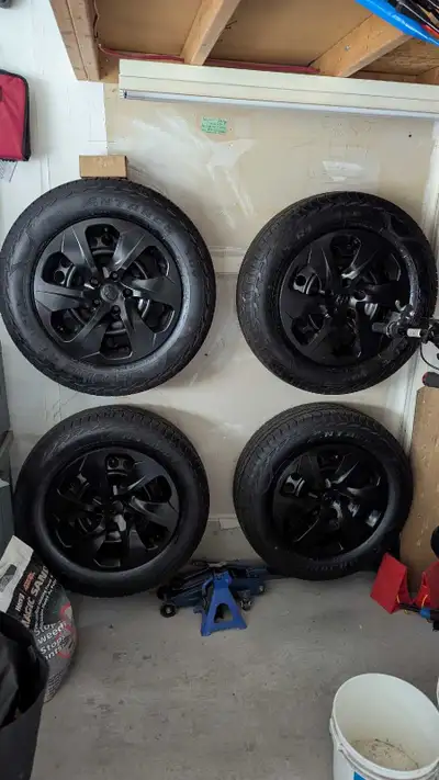 I am selling a set of used 225/65R17 tires mounted on black rims, perfect for your 4x4 vehicle, offe...
