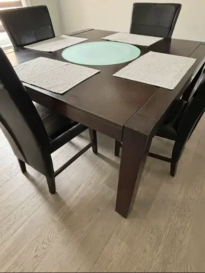 Wood table / Chairs Convenient feature with a built in lazy Susan Comes with 4 chairs in good condit...