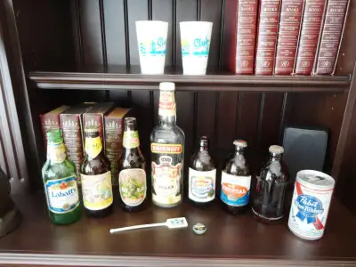 Vintage 1970's & 90's Beer and Vodka Bottles, Cans,Caps and Cups for sale and all listed below price...