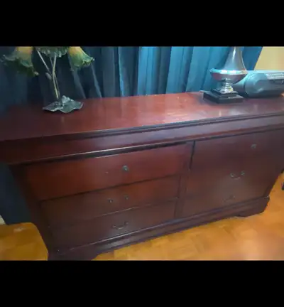 Nice dark wood dresser. There is a mirror that can be attached. It's In great shape but some of the...