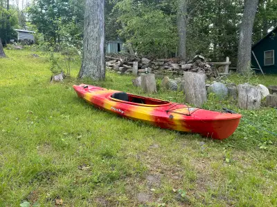 Get ready to paddle into adventure with this vibrant red and yellow Nucky kayak, perfect for solo ex...