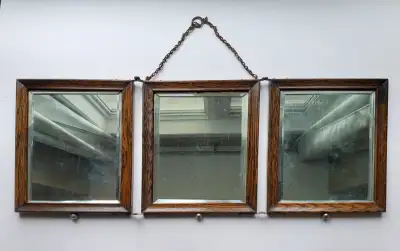 Antique oak folding mirror can be hung by its chain on a wall or set on a vanity (ball feet help pre...