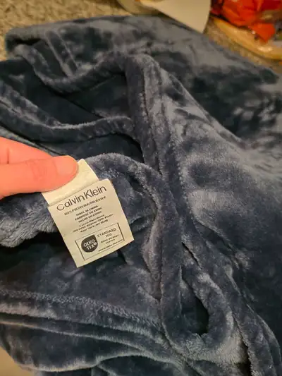 Calvin Klein solid plush blanket made from 100% polyester, View more