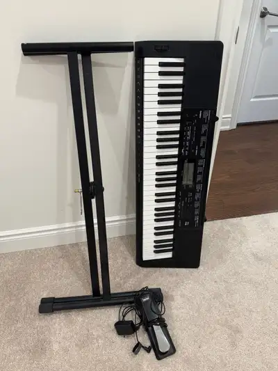 almost brand new key board with its stand and pedal , View more