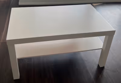 Move out sale- White 90x 55 cm table, has 2 shelves. Accommodating size, easy assembly, and practica...