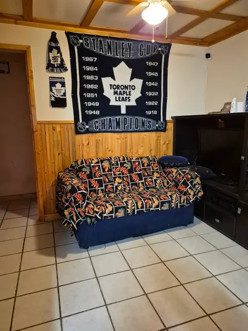 Semi furnished basement room for rent. Includes couch, single bed, and t.v. Private bathroom. Laundr...