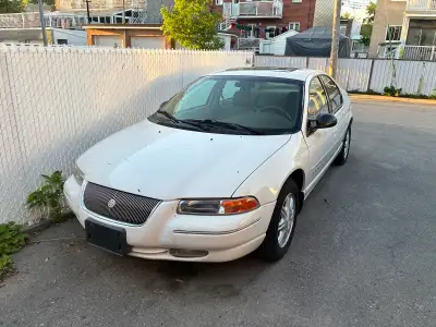 white Chrysler cirrus lx automatic sedan. car has 76k km. interior tan with sun roof on