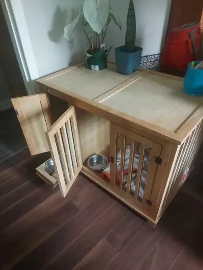 Single medium sized to small dog safety crate..food storage cabinet, and slide out feed tray. 271/2H...