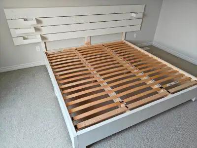 Ikea King bed frame, solid wood., View more