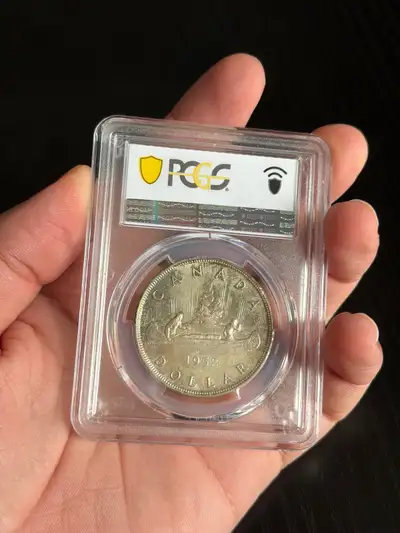 The Canadian silver dollar is an iconic piece of history The coin is certified The coin is silver Th...