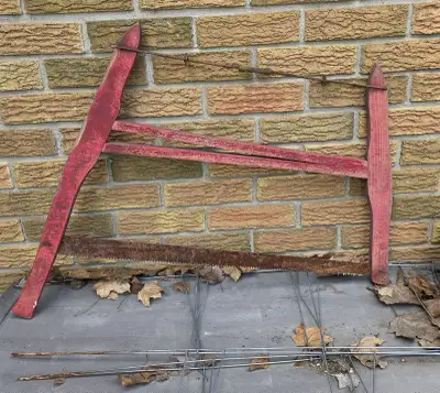 Rustic Décor Appeal Beautiful old wooden bow saw with original red paint and a weathered steel blade...