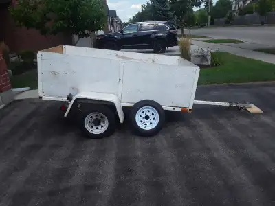 Dimensions are approximately 4 feet by 7 feet Includes ball hitch and spare tire. Plywood floor and...
