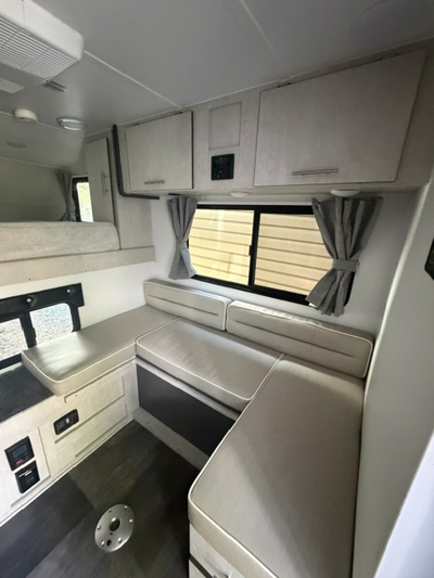 2023 SLIDE IN CAMPER BOUGHT LAST YEAR. PREVIOUS OWNER USED 8 TIMES. I USED IT 2 TIMES THIS IS LIKE B...