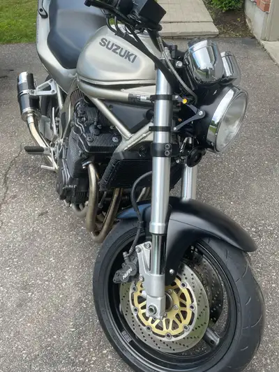 Lots of tasteful mods done to this bike. GSXR-750 front forks. GSXR-1000 rear shock. Delkevic exhaus...