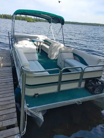 2000 Sweatwater pontoon for sale 22' with trailer has some seats with tears at seams. 60HP Evinrude....