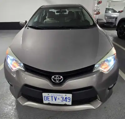 Selling my 2014 Toyota corolla fullyloaded one owner 2 sets of keys no accidents clean title the car...