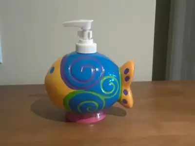 Ceramic fish liquid soap dispenser with pump from Pier 1. Was a gift that I never used. Comes in ori...