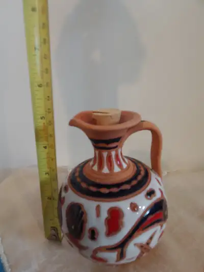 This beautiful, handmade Gianno Rhodes pottery pitcher is a unique piece of art, standing approximat...