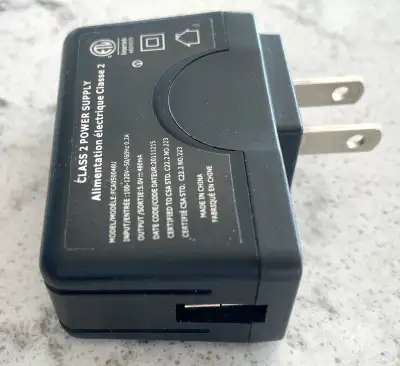 Compact black USB power supply adapter, View more