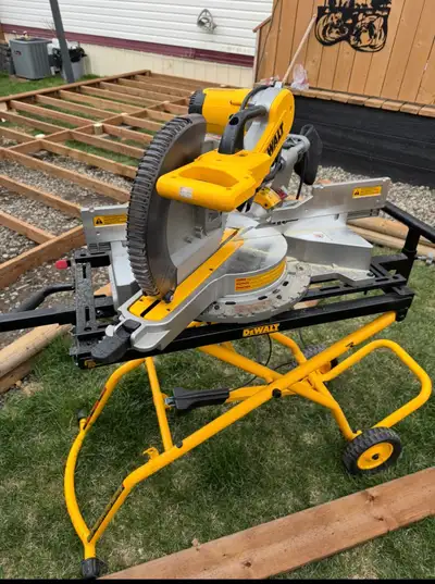 12” Dual bevel sliding Dewalt miter saw on hydraulic stand. Only used a few times. Reason for sellin...
