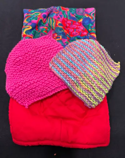 Two handmade lifters that you place in a microwave and hold on the corners to lift hot items out of...