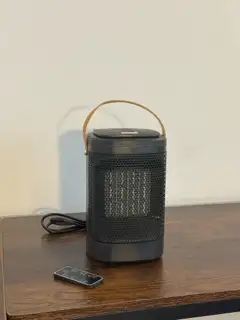 Compact ceramic space heater with remote, touch controls, timer, oscillation, and 3 heat/fan setting...