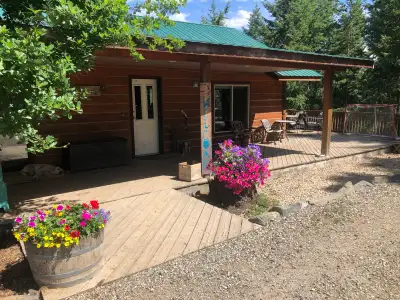 Charming private log, four-bedroom, two-bath home on acreage in Silver Creek. Amazing covered deck,...
