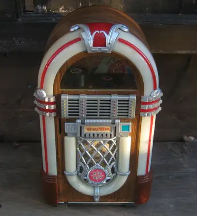 Jukebox coin bank, takes micro cassette tapes and plays when you put a coin in. I do not have any of...